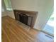 Close up of a wood burning fireplace with hearth and screen insert on the first floor at 867 S Grape St, Denver, CO 80246