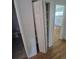Hallway with a folding closet and view into bedroom at 867 S Grape St, Denver, CO 80246