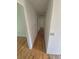 Hallway featuring a hardwood floor and standard white walls leading to bedrooms at 867 S Grape St, Denver, CO 80246