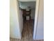 View of the functional kitchen with wood-look flooring, white appliances, and wood cabinets at 867 S Grape St, Denver, CO 80246