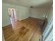 Bright living room featuring hardwood floors and a cozy fireplace on the first floor at 867 S Grape St, Denver, CO 80246
