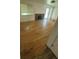 Bright living room with hardwood flooring, fireplace, and sliding glass doors at 867 S Grape St, Denver, CO 80246