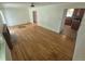 Spacious living room featuring hardwood floors and an open layout with kitchen access at 867 S Grape St, Denver, CO 80246