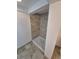 Shower with tiled walls, white shower pan and tile floor at 867 S Grape St, Denver, CO 80246