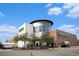 A Whole Foods Market building with a brick exterior and modern architectural design on a sunny day at 5300 E Cherry Creek South Dr # 1327, Denver, CO 80246