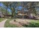Condominium with a treed courtyard and wood pergola at 5300 E Cherry Creek South Dr # 1327, Denver, CO 80246