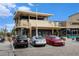 A modern restaurant exterior with outdoor dining, a rooftop patio, and convenient parking spaces at 5300 E Cherry Creek South Dr # 1327, Denver, CO 80246