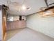 Unfinished basement area with painted walls and carpeted floor at 805 S Lincoln St, Denver, CO 80209