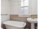 Classic bathroom with a vintage tub and pedestal sink at 805 S Lincoln St, Denver, CO 80209