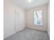 Neat bedroom with plush carpeting and a window at 805 S Lincoln St, Denver, CO 80209