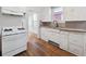 Kitchen showcases updated appliances, wood floors, and ample cabinet space at 805 S Lincoln St, Denver, CO 80209