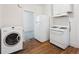 Classic kitchen with white appliances, a gas range, and wooden floors at 805 S Lincoln St, Denver, CO 80209