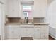Kitchen view with classic white cabinets and stainless steel sink at 805 S Lincoln St, Denver, CO 80209
