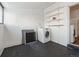Laundry room with washer, black painted floor, and shelving at 805 S Lincoln St, Denver, CO 80209