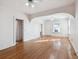 Spacious living room featuring hardwood floors, archway details, and abundant light at 805 S Lincoln St, Denver, CO 80209