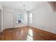 Bright living room featuring hardwood floors and modern chandelier at 805 S Lincoln St, Denver, CO 80209