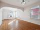 Spacious living room featuring hardwood floors, archway details, and abundant light at 805 S Lincoln St, Denver, CO 80209