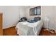 Bright bedroom with a single bed and a chair at 8530 W 46Th Ave, Wheat Ridge, CO 80033