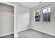 Cozy bedroom featuring two windows allowing lots of natural light and closet at 1285 W 9Th Ave, Denver, CO 80204