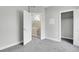 A carpeted bedroom with a double-door closet and two doorways at 1285 W 9Th Ave, Denver, CO 80204