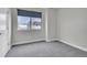 A clean, carpeted bedroom with a bright window at 1285 W 9Th Ave, Denver, CO 80204