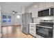 A bright kitchen with stainless steel appliances and a refrigerator with water dispenser at 1285 W 9Th Ave, Denver, CO 80204