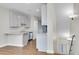 Bright kitchen with white cabinets, stainless steel appliances, and modern finishes at 1285 W 9Th Ave, Denver, CO 80204