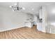 Bright living room featuring modern chandelier, hardwood floors, and neutral color palette at 1285 W 9Th Ave, Denver, CO 80204