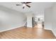 An open-concept living room with wood floors flowing into the kitchen and a staircase to the upper level at 1285 W 9Th Ave, Denver, CO 80204