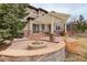 Backyard patio with outdoor firepit, landscaping, and pergola covered outdoor dining area at 5334 Sedona Dr, Parker, CO 80134