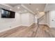 Spacious finished basement with hardwood floors, modern lighting, and staircase at 5334 Sedona Dr, Parker, CO 80134
