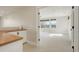 Bright view into primary bedroom suite featuring an attached butler's pantry at 5334 Sedona Dr, Parker, CO 80134