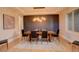 Sophisticated dining room with hardwood floors, modern lighting, and seating for six at 5334 Sedona Dr, Parker, CO 80134