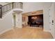 Bright dining room featuring a staircase, hardwood floors, and views into the dining room at 5334 Sedona Dr, Parker, CO 80134