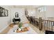 A stylish foyer with decorative furniture, a staircase, and hardwood floors at 5334 Sedona Dr, Parker, CO 80134