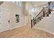 Bright foyer showcases soaring ceilings, hardwood floors, and an elegant staircase at 5334 Sedona Dr, Parker, CO 80134