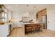 Modern kitchen with a large island, stainless steel appliances, and stylish pendant lighting at 5334 Sedona Dr, Parker, CO 80134