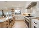 Beautiful kitchen with a center island, stainless steel appliances, and scenic views from the window at 5334 Sedona Dr, Parker, CO 80134