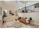 Bright living room boasting soaring ceilings, many windows, hardwood floors, and a modern railing at 5334 Sedona Dr, Parker, CO 80134