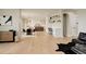 Spacious open-concept layout with hardwood floors connecting the living, dining, and kitchen areas at 5334 Sedona Dr, Parker, CO 80134