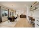 Bright and airy living space leading to a modern kitchen and dining area with stylish light fixtures at 5334 Sedona Dr, Parker, CO 80134