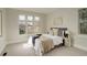 Cozy main bedroom with ample natural light, neutral walls, and a stylish platform bed at 5334 Sedona Dr, Parker, CO 80134