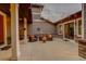 Outdoor patio with string lights, comfortable seating, and brick accents at 5334 Sedona Dr, Parker, CO 80134