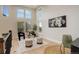 Bright sitting room with high ceilings, large windows, and stylish decor at 5334 Sedona Dr, Parker, CO 80134