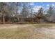 Spacious backyard features a wooden fence, mature trees, and ample lawn area at 12014 E Mexico Ave, Aurora, CO 80012