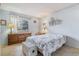 Comfortable bedroom featuring blue walls, carpet flooring, a window, and warm lamps at 12014 E Mexico Ave, Aurora, CO 80012