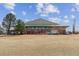Community building with large windows, brick facade, and expansive lawn at 12014 E Mexico Ave, Aurora, CO 80012