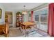 Cozy dining area with carpet flooring and sliding glass doors to the backyard at 12014 E Mexico Ave, Aurora, CO 80012