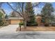 Charming single-Gathering home featuring a brick facade and mature trees in a well-maintained front yard at 12014 E Mexico Ave, Aurora, CO 80012