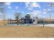 Colorful community playground with climbing structures, slides, and a cushioned play area at 12014 E Mexico Ave, Aurora, CO 80012